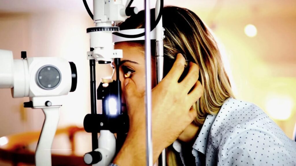 Optometrist conducting an eye exam on a patient to detect cataracts and glaucoma
