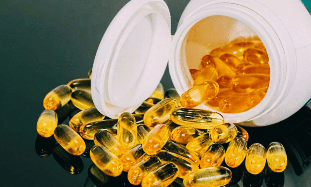 A close-up of various nutritional supplement pills and bottles.
