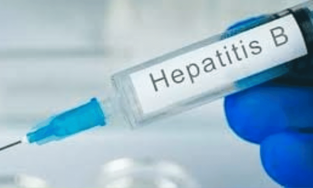 Doctor administering hepatitis B vaccine to a newborn baby.
