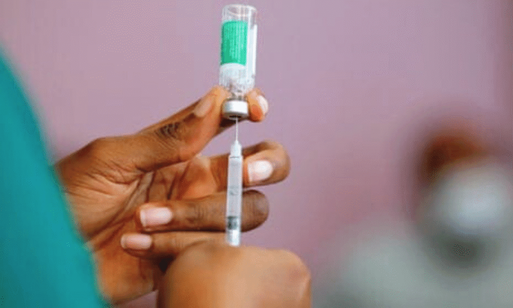 A doctor administering a COVID-19 vaccine to a senior patient.