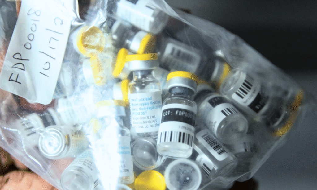 A syringe and vial labeled "MPOX Vaccine" on a map of California.